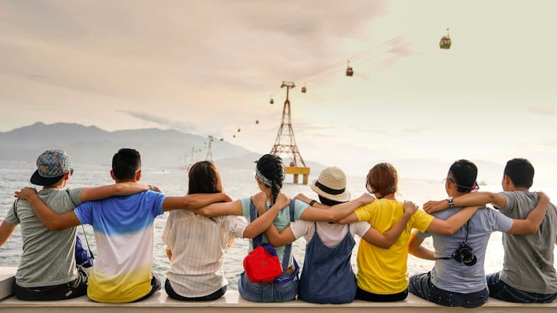 Supportive community group sitting in a warm, relaxed discussion circle